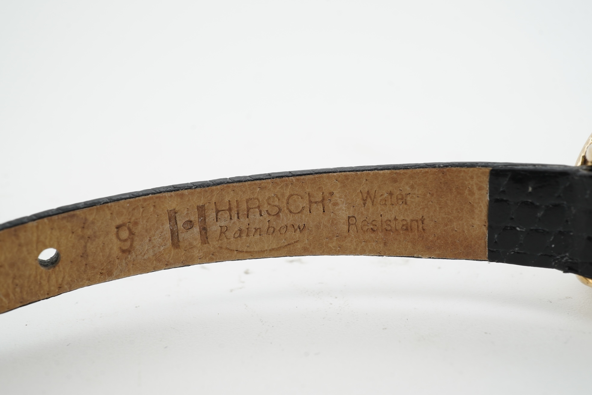 A lady's recent 9ct gold Rotary quartz wrist watch, with oval Roman dial, case diameter 18mm, on an associated leather strap, no box or papers.